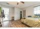 Comfortable bedroom with hardwood floors, storage, a window, and easy access to other areas of the home at 4 Brandy Hills Dr, Port Orange, FL 32129