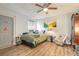 Cozy bedroom featuring a ceiling fan, warm lighting, and comfortable decor, creating a welcoming space at 4 Brandy Hills Dr, Port Orange, FL 32129