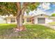 Charming single-story home featuring a well-manicured lawn and attached garage at 4 Brandy Hills Dr, Port Orange, FL 32129
