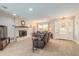 Inviting living room with a cozy fireplace, tile flooring and bright, double glass door entrance at 4 Brandy Hills Dr, Port Orange, FL 32129