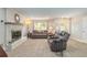 Charming living room features tile flooring, a cozy fireplace, and a view of the front yard at 4 Brandy Hills Dr, Port Orange, FL 32129