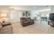 Open living room with tile floors leading to the dining area and featuring cozy, comfortable seating at 4 Brandy Hills Dr, Port Orange, FL 32129