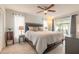Bright main bedroom featuring wood-look floors, and a sliding glass door at 4 Brandy Hills Dr, Port Orange, FL 32129