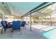 Inviting pool patio area with an outdoor dining set, lounge chairs, and easy access to the refreshing pool at 4 Brandy Hills Dr, Port Orange, FL 32129