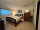 Comfortable bedroom with a bed, dresser, and neutral tones at 411 N Halifax Ave # 208, Daytona Beach, FL 32118