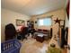 Cozy room with tile flooring, natural light, and neutral tones, ideal for relaxation or a home office setup at 411 N Halifax Ave # 208, Daytona Beach, FL 32118