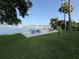 Scenic park featuring picnic tables and grills with waterfront views and a bridge in the backdrop at 411 N Halifax Ave # 208, Daytona Beach, FL 32118
