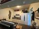 Efficient kitchen with white cabinets and appliances at 411 N Halifax Ave # 208, Daytona Beach, FL 32118