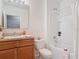 Bathroom features a vanity, toilet and tub with shower at 422 Armoyan Way, New Smyrna Beach, FL 32168