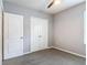 A bedroom with grey walls, carpet flooring, ceiling fan, and a closet for storage at 422 Armoyan Way, New Smyrna Beach, FL 32168