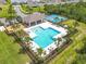 Overhead shot of the community pool with a playground and tennis courts at 422 Armoyan Way, New Smyrna Beach, FL 32168
