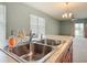 Kitchen sink with backyard view and an open floor plan at 422 Armoyan Way, New Smyrna Beach, FL 32168