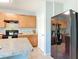 The kitchen features sleek black appliances, wood cabinetry, and an island at 422 Armoyan Way, New Smyrna Beach, FL 32168
