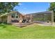 A well-maintained backyard features a deck area, perfect for enjoying the outdoors with friends and Gathering at 43350 Natchez St, Deland, FL 32720