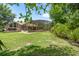 This spacious, grassy backyard features an enclosed pool, and is ideal for relaxation or entertaining at 43350 Natchez St, Deland, FL 32720
