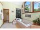 Bright bathroom features a tiled tub with steps, a shower and large window for ample natural light at 43350 Natchez St, Deland, FL 32720