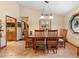 Open dining room features a wooden table and chairs with tile floors and natural light at 43350 Natchez St, Deland, FL 32720