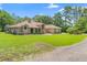 This beautiful brick home features a spacious lawn and manicured landscaping, offering plenty of curb appeal at 43350 Natchez St, Deland, FL 32720