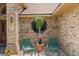 Charming front porch features a quaint seating area, perfect for relaxing and enjoying the home's inviting exterior at 43350 Natchez St, Deland, FL 32720