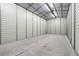 Indoor shot of a well-lit, empty garage with smooth concrete floors, white metal walls and overhead fluorescent lights at 43350 Natchez St, Deland, FL 32720