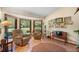 Cozy living room with tile floors, large windows, and comfortable seating, perfect for relaxation and gatherings at 43350 Natchez St, Deland, FL 32720
