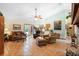 Spacious living area with tile flooring and doors leading to the pool, offering seamless indoor-outdoor living at 43350 Natchez St, Deland, FL 32720