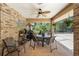 Covered patio featuring outdoor furniture, a ceiling fan, and views of the screened pool area at 43350 Natchez St, Deland, FL 32720
