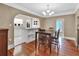 Bright dining room with hardwood floors and open access to the kitchen and bonus room at 441 N Julia Ave, Deland, FL 32720