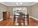 Charming dining room with hardwood floors and access to the kitchen at 441 N Julia Ave, Deland, FL 32720