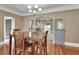 The dining room boasts wood floors and archways leading into other rooms at 441 N Julia Ave, Deland, FL 32720