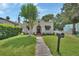 Inviting home with a lush lawn, paved walkway, and mailbox at 441 N Julia Ave, Deland, FL 32720
