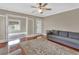Open living space with hardwood floors, neutral walls, and access to an additional room at 441 N Julia Ave, Deland, FL 32720