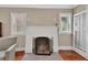 Bright living room with a fireplace, natural light, and hardwood floors at 441 N Julia Ave, Deland, FL 32720
