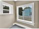 Window views of the property's exterior with a white picket fence and blue house at 441 N Julia Ave, Deland, FL 32720
