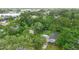 Overhead view of a house showcasing the neighborhood and property boundaries in a wooded area at 507 Sand Ave, Apopka, FL 32703