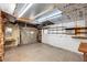 Spacious basement with work bench, shelving, and overhead lighting at 507 Sand Ave, Apopka, FL 32703