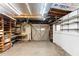 Open basement with shelving, work bench, and overhead lighting at 507 Sand Ave, Apopka, FL 32703