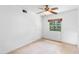 Plain bedroom with ceiling fan, window and empty walls at 507 Sand Ave, Apopka, FL 32703