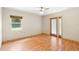 Bedroom with laminate floors, window and glass door leading to outdoor space at 507 Sand Ave, Apopka, FL 32703