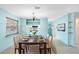 Inviting dining area with a view into the kitchen, perfect for Gathering meals at 507 Sand Ave, Apopka, FL 32703