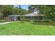 Charming home with a well-maintained lawn and lush landscaping at 507 Sand Ave, Apopka, FL 32703