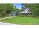 Inviting home with well-manicured lawn and mature trees at 507 Sand Ave, Apopka, FL 32703
