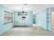 Open-concept dining area flowing into the kitchen with built-in cabinets and ample counter space at 507 Sand Ave, Apopka, FL 32703