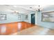 Bright living room with gleaming hardwood floors and natural light at 507 Sand Ave, Apopka, FL 32703