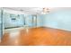 Open-concept layout connecting the living room to the kitchen and dining areas at 507 Sand Ave, Apopka, FL 32703