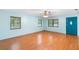 Bright and airy living room with hardwood floors and abundant natural light at 507 Sand Ave, Apopka, FL 32703