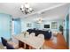 Bright living room featuring stylish furniture, hardwood floors, and ample natural light at 507 Sand Ave, Apopka, FL 32703
