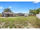 Large backyard featuring a screened pool area and storage shed, providing ample space at 510 Apollo Ave, Deltona, FL 32725