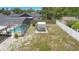 Aerial view of a backyard with a pool, shed, and fenced yard at 510 Apollo Ave, Deltona, FL 32725