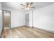 Spacious bedroom with wood-look floors, and adjacent bathroom, perfect for relaxation at 510 Apollo Ave, Deltona, FL 32725